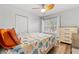 Inviting bedroom with a cheerful bedspread, hardwood floors, and a window offering bright, natural light at 214 Cape Harbour Loop # 105, Bradenton, FL 34212