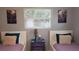 Bedroom with twin beds, nightstand, and window with blinds at 2392 Indigo Dr, Clearwater, FL 33763