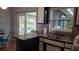 Kitchen features a breakfast bar, stainless steel sink, and view to backyard at 2392 Indigo Dr, Clearwater, FL 33763