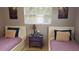 Bedroom with twin beds, nightstand, and window with blinds at 2392 Indigo Dr, Clearwater, FL 33763