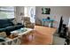 Cozy living room featuring hardwood floors, comfy seating, and tasteful decor at 2392 Indigo Dr, Clearwater, FL 33763