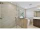 Modern bathroom with a glass-enclosed shower and a soaking tub at 302 W Wilder Ave, Tampa, FL 33603