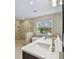 Modern bathroom with double vanity, soaking tub, and shower at 302 W Wilder Ave, Tampa, FL 33603