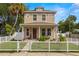 Two-story home with a white picket fence and well-manicured lawn at 1407 7Th N Ave, St Petersburg, FL 33705