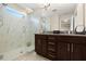 Bathroom with granite countertops, double sinks, and walk-in shower at 1407 7Th N Ave, St Petersburg, FL 33705