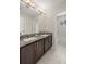 Modern bathroom with double sinks, granite countertops and a shower/tub combo at 1407 7Th N Ave, St Petersburg, FL 33705