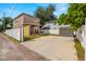 View of the home from the driveway, showcasing the front and side yard at 1407 7Th N Ave, St Petersburg, FL 33705