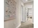 Hallway with carpet flooring and a floral wall hanging at 1407 7Th N Ave, St Petersburg, FL 33705