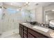 Elegant bathroom with double vanity, granite countertop, and a large shower at 1407 7Th N Ave, St Petersburg, FL 33705