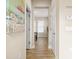 Bright hallway with light neutral walls and wood-look tile floors at 1407 7Th N Ave, St Petersburg, FL 33705