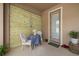 Private patio area with small table and chairs, perfect for morning coffee at 1407 7Th N Ave, St Petersburg, FL 33705