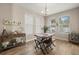 Bright dining room with a rustic wooden table and three chairs, with natural light at 1407 7Th N Ave, St Petersburg, FL 33705