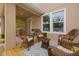 Relaxing wooden deck with wicker chairs and rug at 1407 7Th N Ave, St Petersburg, FL 33705