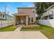 Two story home with small front porch and a charming exterior at 1407 7Th N Ave, St Petersburg, FL 33705