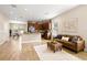 Spacious living room with hardwood floors and an open floor plan to the kitchen at 1407 7Th N Ave, St Petersburg, FL 33705