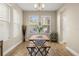 Charming dining area with wooden table and benches, featuring natural light at 1407 7Th N Ave, St Petersburg, FL 33705