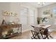Cozy dining area with rustic wooden table and benches near the kitchen at 1407 7Th N Ave, St Petersburg, FL 33705