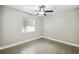 Well-lit bedroom featuring wood-look floors and a ceiling fan at 7694 62Nd N St, Pinellas Park, FL 33781