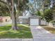 Newly renovated gray house with white garage door at 7694 62Nd N St, Pinellas Park, FL 33781