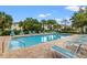Community pool with plenty of lounge chairs for relaxing at 214 Cape Harbour Loop # 105, Bradenton, FL 34212