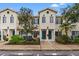 Front view of two story townhouses with landscaping at 214 Cape Harbour Loop # 105, Bradenton, FL 34212
