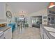 Open concept kitchen with breakfast nook and view to living room at 2203 W Del Webb Blvd, Sun City Center, FL 33573