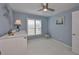 Charming bedroom with window, featuring plantation shutters, and neutral decor at 2203 W Del Webb Blvd, Sun City Center, FL 33573