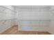 Large walk-in closet with wire shelving for ample storage at 13716 Brookside Haven St, Riverview, FL 33578