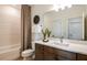 Elegant bathroom with a modern vanity and a bathtub at 13716 Brookside Haven St, Riverview, FL 33578