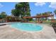 Inviting pool with pergola and lake view at 2153 Karan Way, Clearwater, FL 33763