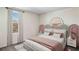 Charming bedroom with a unique headboard and soft color palette at 7107 Broad River Ave, Land O Lakes, FL 34638