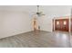 Spacious living room featuring laminate floors and a ceiling fan at 15904 Nottinghill Dr, Lutz, FL 33548