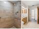 Bathroom featuring a walk-in shower with grab bars at 15904 Nottinghill Dr, Lutz, FL 33548