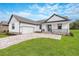 Modern farmhouse exterior with two-car garage at 5934 Summit View Dr, Brooksville, FL 34601