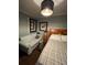 Bedroom with light gray walls and a comfy couch at 2255 Trelain S Dr, St Petersburg, FL 33712