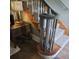 Elegant staircase with a wooden handrail and carpeted steps at 2255 Trelain S Dr, St Petersburg, FL 33712