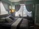 Comfortable bedroom with a queen-sized bed and window seating at 2255 Trelain S Dr, St Petersburg, FL 33712