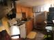 Small kitchen with stove, sink, and wooden cabinets at 2255 Trelain S Dr, St Petersburg, FL 33712