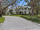 Two-story house with a wraparound porch and lush landscaping at 4601 Bayshore Blvd, Tampa, FL 33611