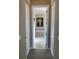 Bathroom entryway with a view of a soaking tub and tiled floors, creating a spa-like atmosphere at 16015 Cape Coral Dr, Wimauma, FL 33598