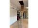 Garage with pull-down attic stairs, peg board and shelving at 16015 Cape Coral Dr, Wimauma, FL 33598