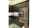 Gourmet kitchen boasts stainless steel refrigerator and dark cabinetry at 16015 Cape Coral Dr, Wimauma, FL 33598