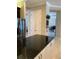 Kitchen island with granite countertop and stainless steel appliances at 16015 Cape Coral Dr, Wimauma, FL 33598