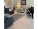 Inviting living room featuring tile floors and comfortable leather seating at 16015 Cape Coral Dr, Wimauma, FL 33598