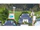 Aerial view showcases private pool, boat dock, and a lush landscape at 3127 W Sligh Ave # 204B, Tampa, FL 33614