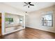 Bedroom featuring a window with a view and a closet with mirrored doors at 3127 W Sligh Ave # 204B, Tampa, FL 33614