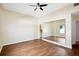 Spacious bedroom with wood floors, closet with mirrored doors, and a ceiling fan at 3127 W Sligh Ave # 204B, Tampa, FL 33614