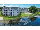 Waterfront condo with private dock, screened balconies, and community pool at 3127 W Sligh Ave # 204B, Tampa, FL 33614