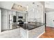 Modern kitchen with stainless steel appliances, dark countertops, and stylish pendant lighting at 3127 W Sligh Ave # 204B, Tampa, FL 33614