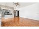 Bright living room showcasing a kitchen with stainless steel appliances and laundry machines at 3127 W Sligh Ave # 204B, Tampa, FL 33614